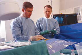 Two Doctors working on a spine patient